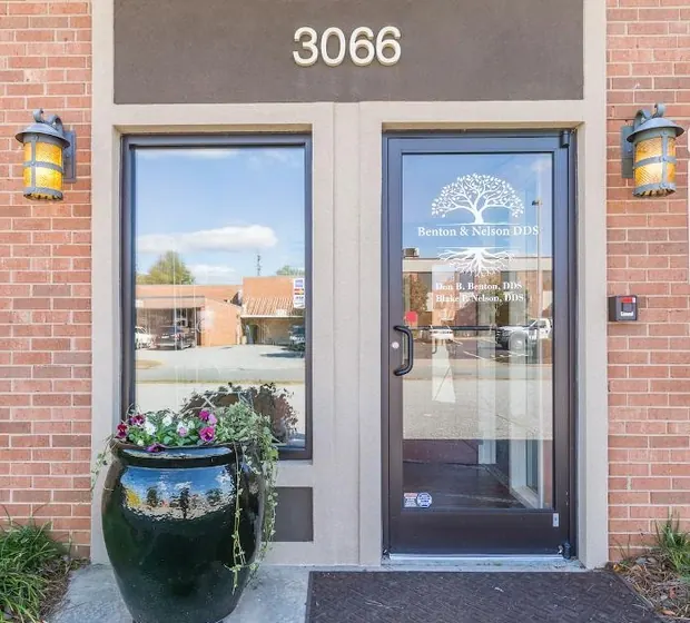 The front door of Blake Nelson, DDS at 3066 Trenwest Drive, with the practice's tree logo on the glass.